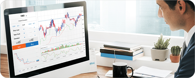 Analyst using AI stock research dashboard on laptop